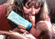 mom feeding baby